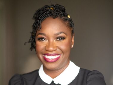 Ebony Johnson, therapist, wearing a black shirt portrait shot